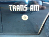 Close-up of front fender script on a 1976 LE T/A 