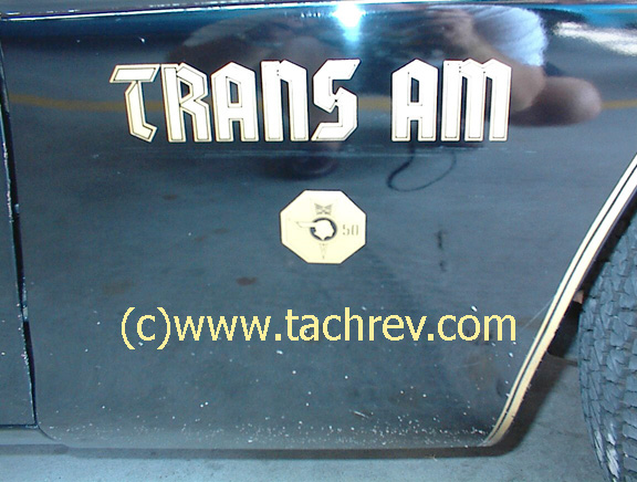 Close-up of front fender script on a 1976 LE T/A 