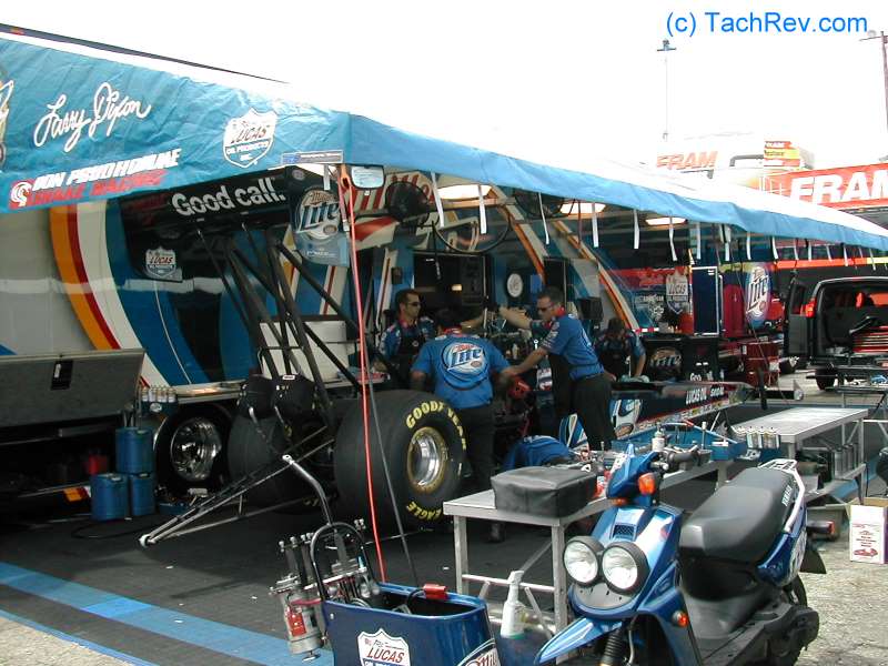 Snake Racing Crew spinning the Top Fuel engine over by hand.