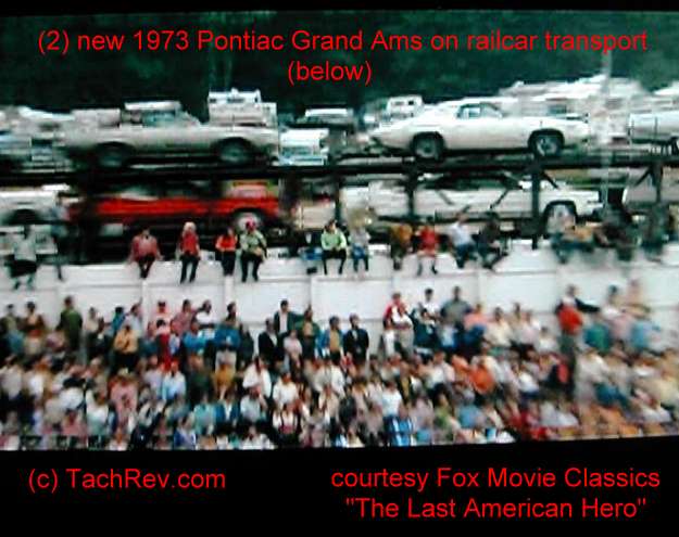 The train passes loaded with cars including two 1973 Grand Am's: (1) White and followed by (1) Silver with Burgundy Vinyl Roof. Estimate is that the train was moving about 45mph in the background, hence the poor quality of the car image(s). Image(s) Courtesy Fox Movie Classics.