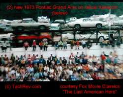 The train passes loaded with cars including two 1973 Grand Am's: (1) White and followed by (1) Silver with Burgundy Vinyl Roof. Estimate is that the train was moving about 45mph in the background, hence the poor quality of the car image(s). Image(s) Courtesy Fox Movie Classics.