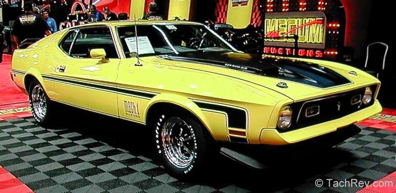 This image is just before this Lot S151 1971 Mustang Mach 1 429 CJ Ram Air rolled of the auction block to its' new owner. Mecum Houston 2012 SOLD!