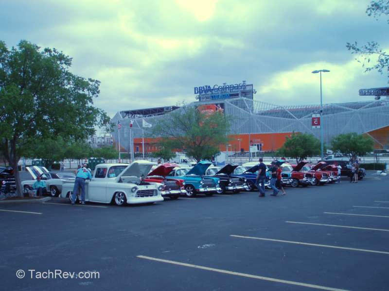 Chevy clubs with many nice rides with the Houston Dynamo stadium in the background. 