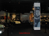 My entrance into the Steve McQueen exhibit garnered this eye candy: Steve driving in the Movie Le Mans on the back wall with his racecar below, the Mustang from the movie BULLET, other cars he owned and the many movie images of Steve McQueen.